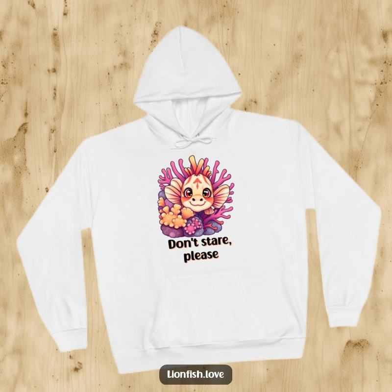 Funny hoodie showcasing a wide-eyed curious lionfish peeking from vibrant coral, designed for warmth and a touch of underwater whimsy.