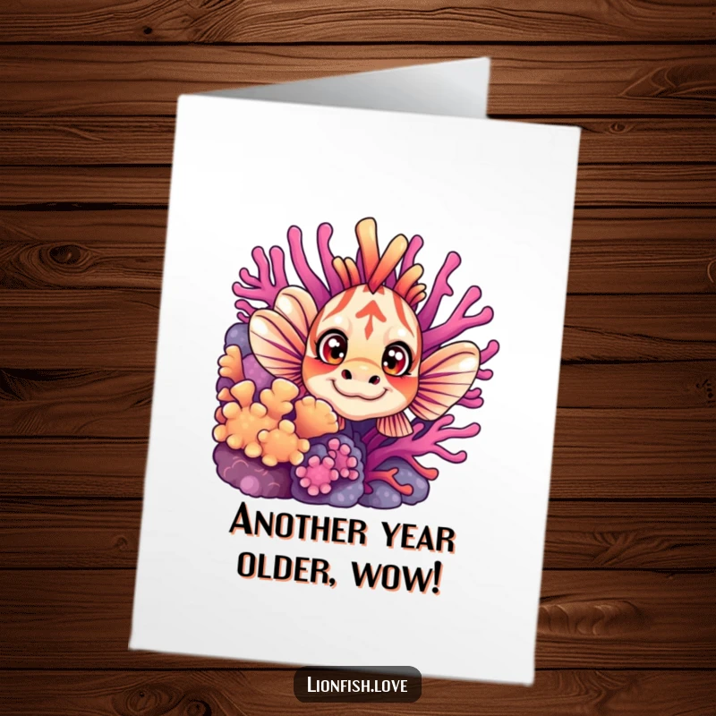 Funny Free Printable Birthday Card with a curious lionfish peeking from vibrant coral, wide-eyed and ready to party.